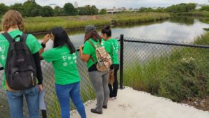 Groundwork Elizabeth Green Team students use a recently installed lookout point to view the Elizabeth River. Photo: Groundwork Elizabeth.